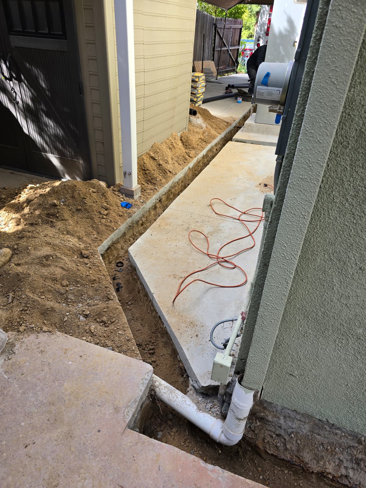 Laundry and kitchen drain line reroute under the slab without going inside the home.